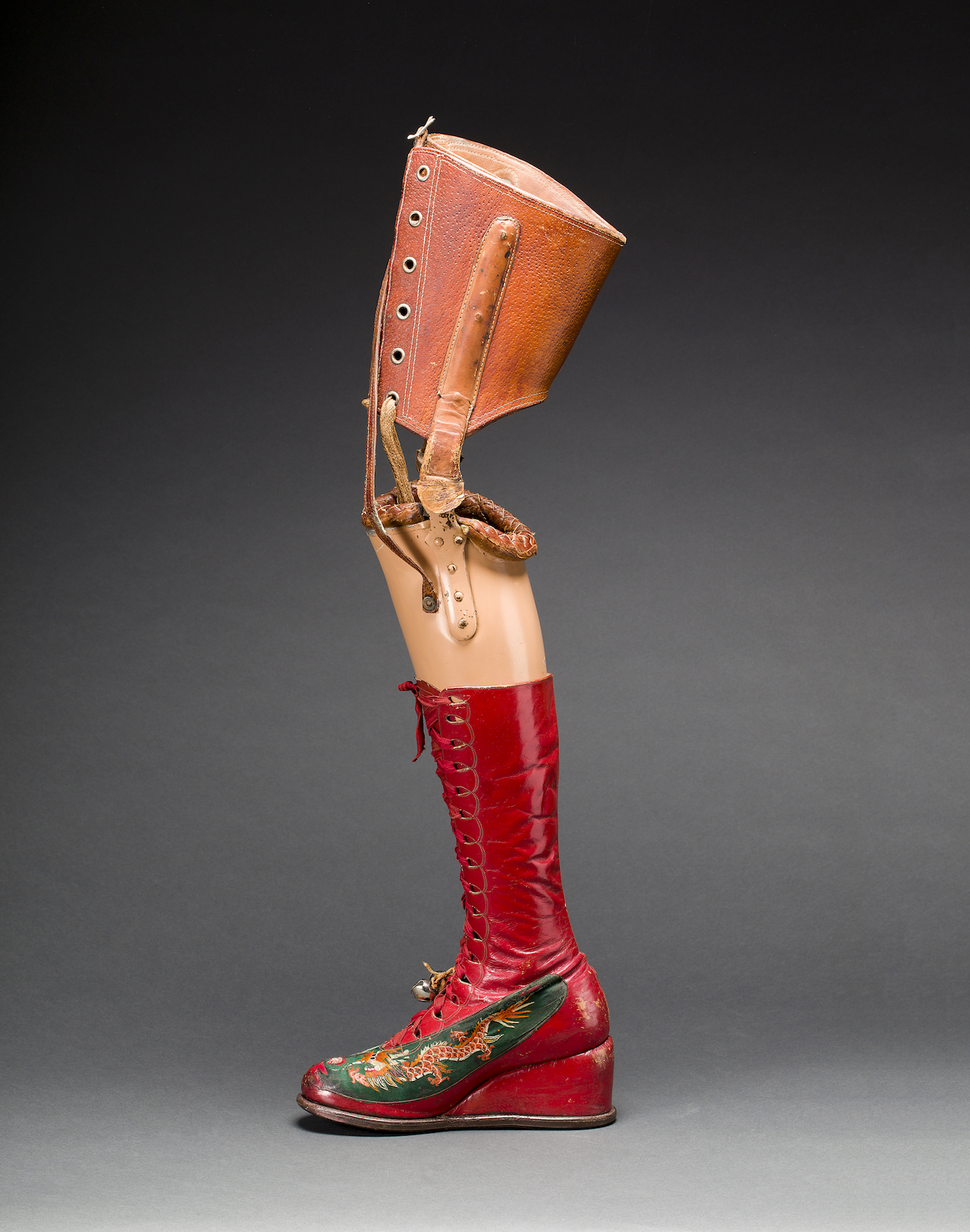 Prosthetic leg with leather boot. Appliquéd silk with embroidered Chinese motifs. From Frida Kahlo: Making Her Self Up, 16 June-14 November. Photograph Javier Hinojosa. Museo Frida Kahlo. Diego Riviera and Frida Kahlo Archives