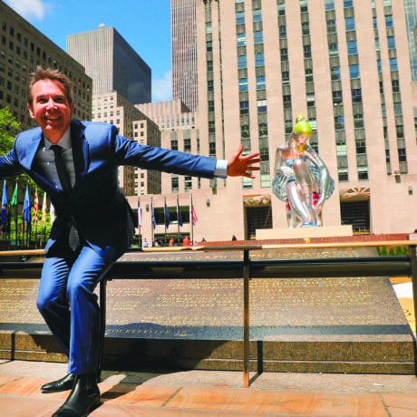 Artist Jeff Koons poses in Rockefeller Center in front of Seated Ballerina, a new public art project on May 12, 2017 in New York City. Photo by Spencer Platt/Getty Images