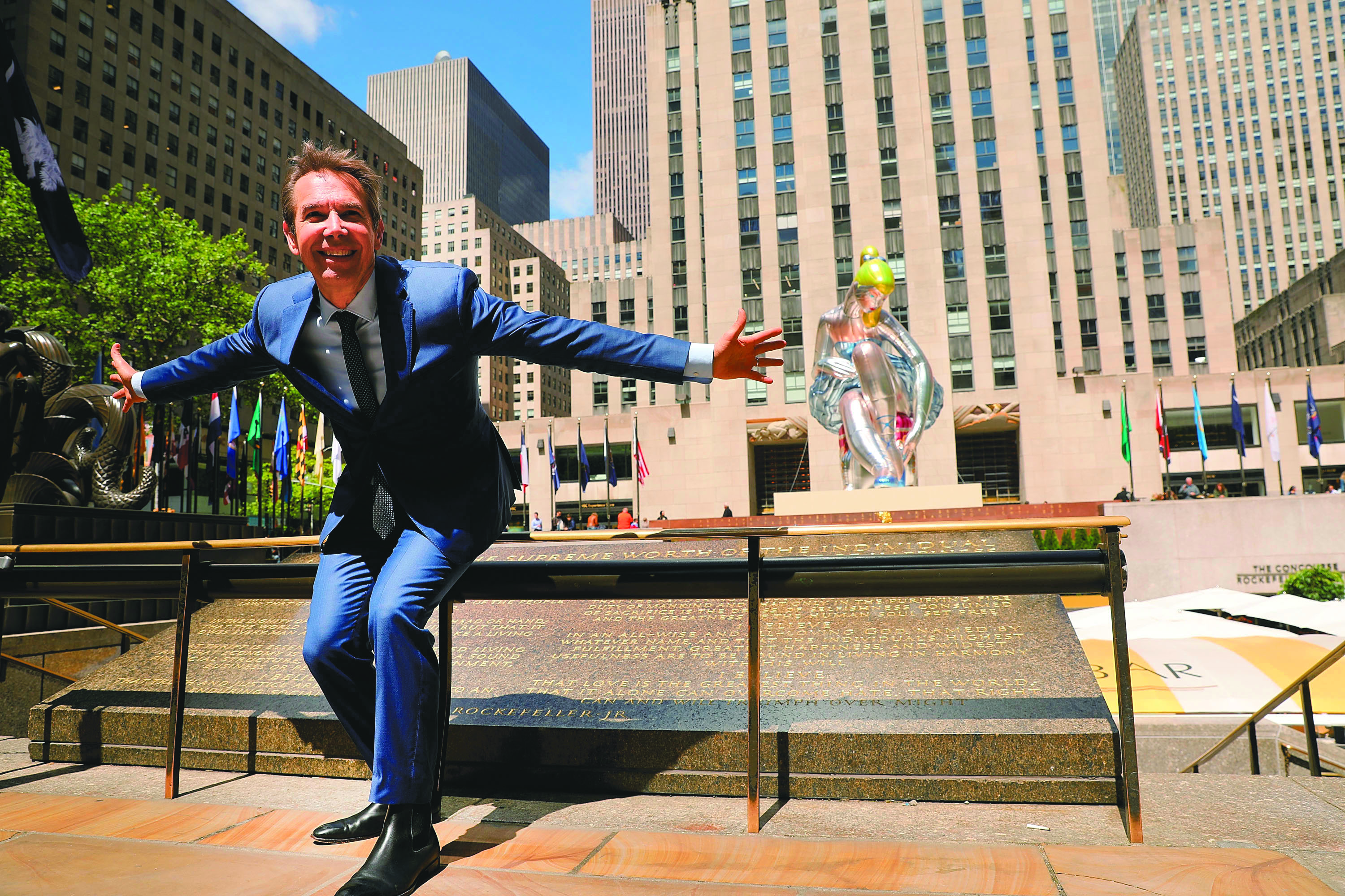 Artist Jeff Koons poses in Rockefeller Center in front of Seated Ballerina, a new public art project on May 12, 2017 in New York City. Photo by Spencer Platt/Getty Images