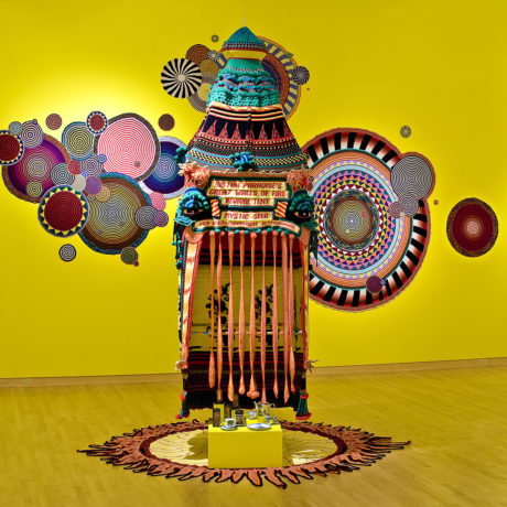 Xenobia Bailey, Sistah Paradise's Great Wall of Fire Tent (installation view, John Michael Kohler Arts Center), 1993; acrylic and cotton yarn and mixed media. Courtesy of the artist.