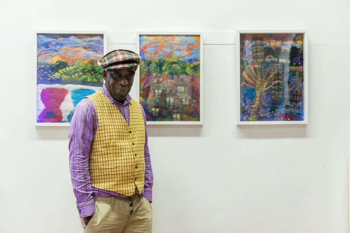 Luton born milliner, designer and artist Alva Clifford Wilson with his felt paintings as part of 'HIVE', a project developed in collaboration with creative producer Julia Cheng, 2018.