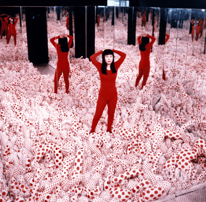 Yayoi Kusama posing in Infinity Mirror Roomâ€” Phalli's Field in the Castellane Gallery, New York Â© Yayoi Kusama