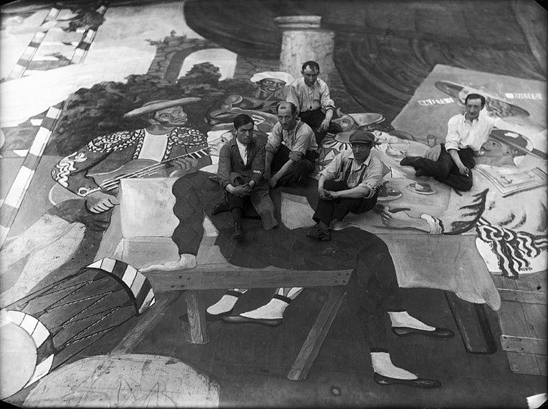Pablo Picasso and scene painters on the set of Ballets Russes Parade, 1917, via Wikimedia Commons