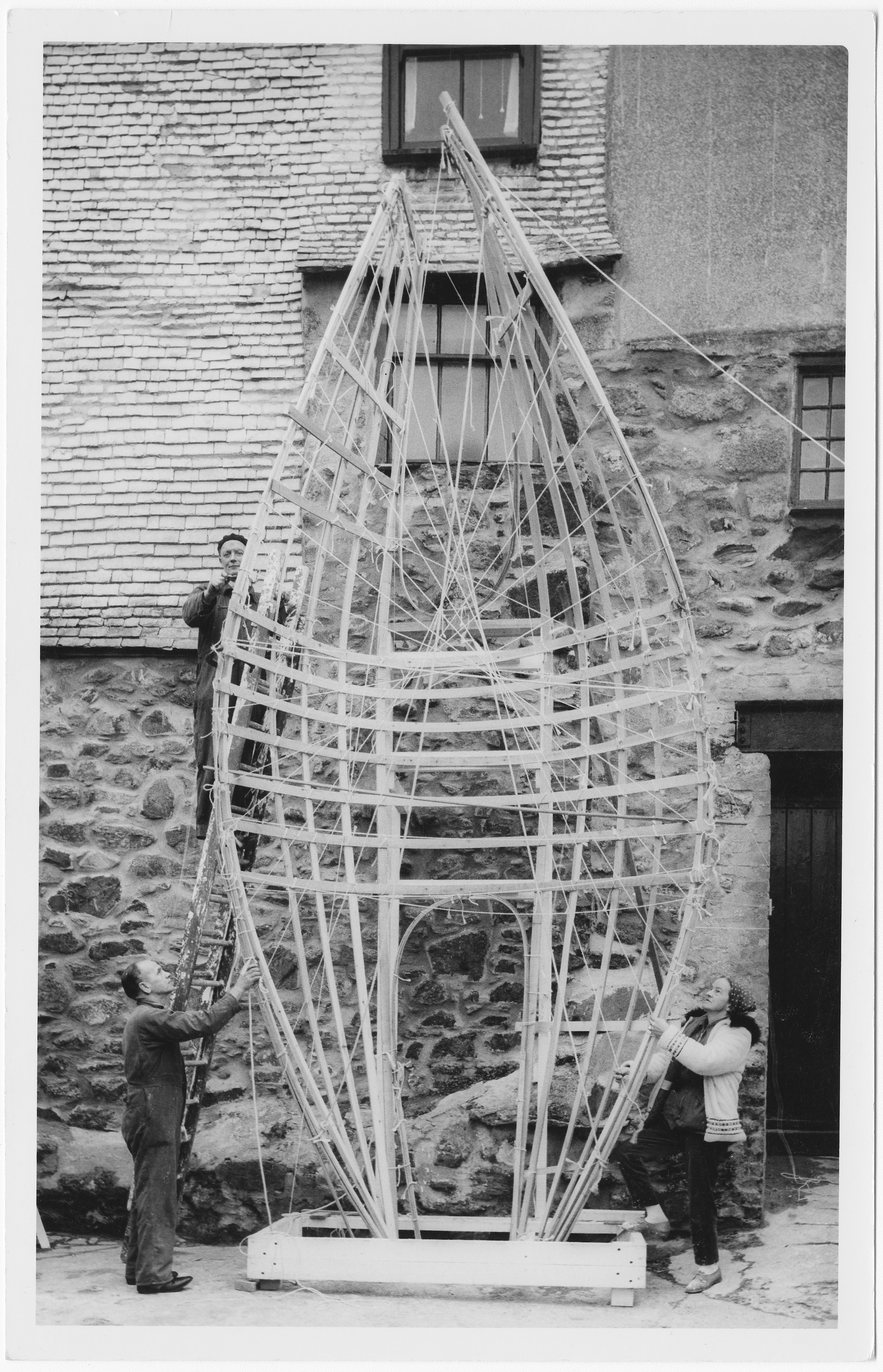 Barbara Hepworth working on the first stage of the armature of the Winged Figure prototype, 31 January 1962