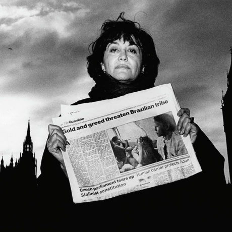 Claudia Andujar with the newspaper The Guardian Photo by Robert M. Davis/Oxfam, London 1989
