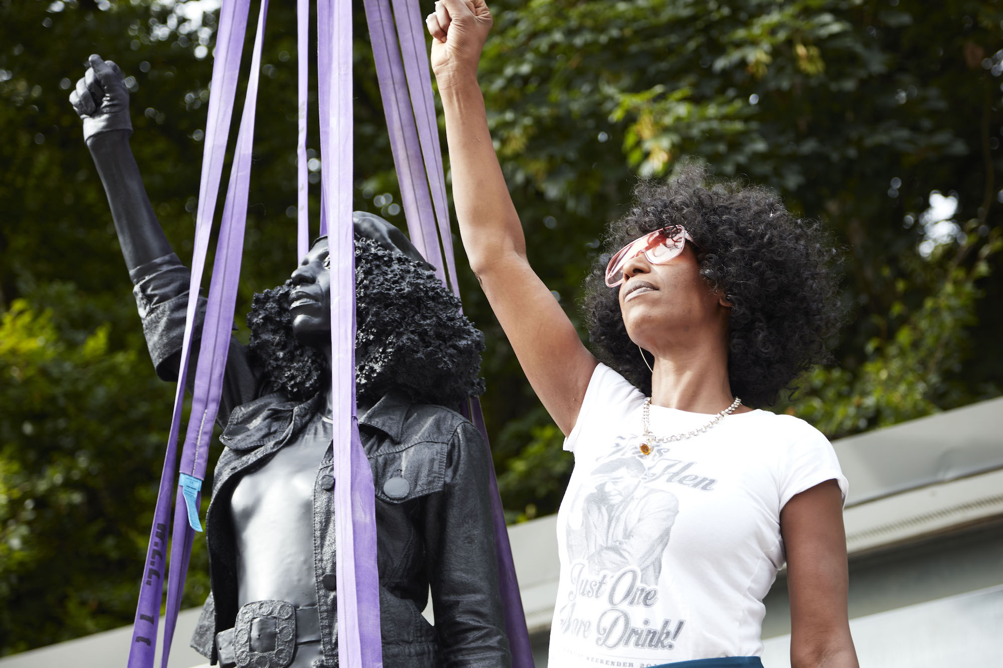 A Surge of Power (Jen Reid) 2020, Marc Quinn, 2020. Jen Reid stands with the artwork before it is installed. Image copyright Marc Quinn studio