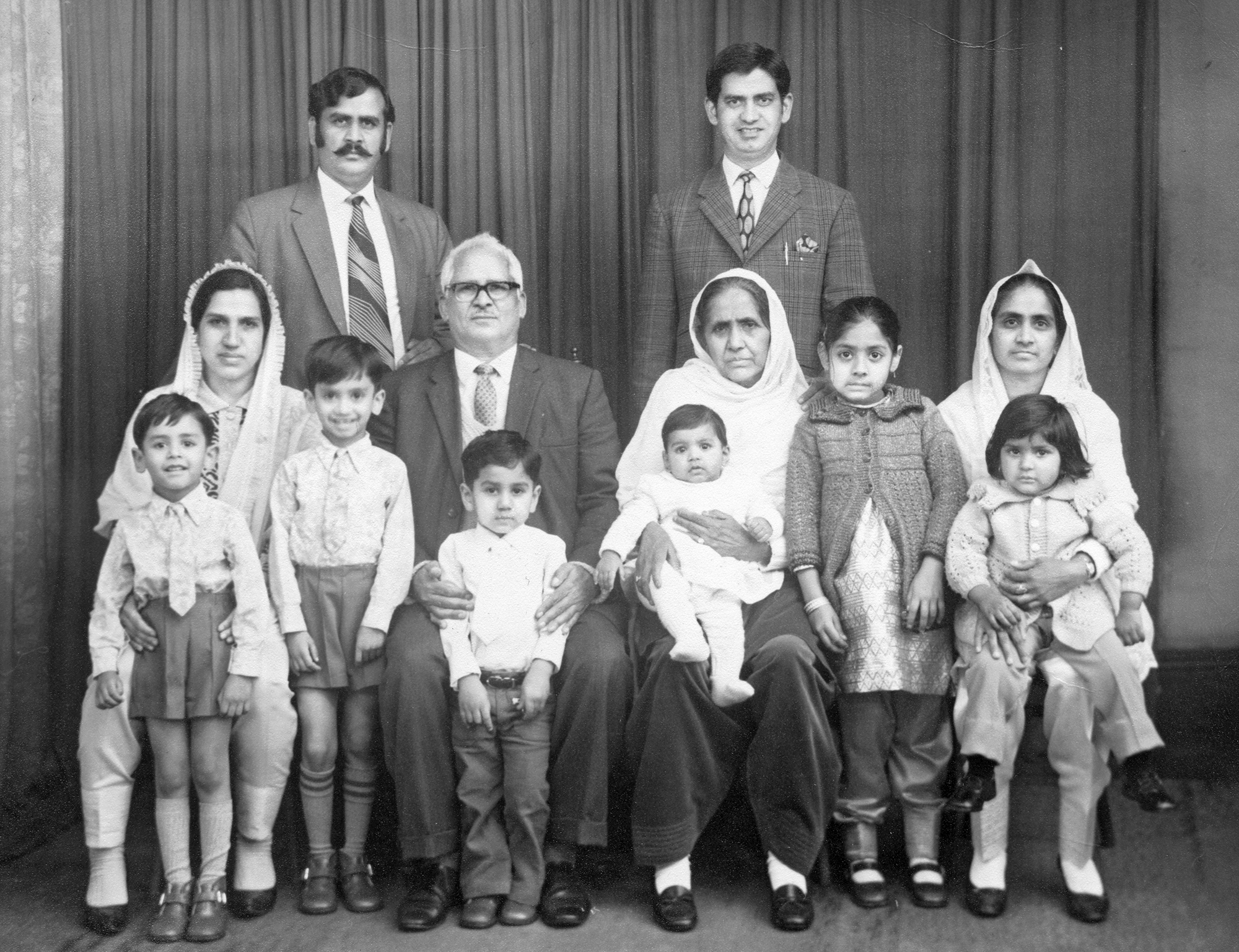 Belle Vue Studios portrait of a 3 generation South Asian family