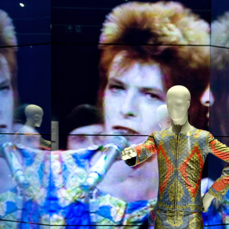 E0PEHB Berlin, Germany. 18th May, 2014. A movie, which is reflected by mirror walls, shows a performance by Bowie at BBC's Top of the Pops from 1972 at the 'David Bowie' exhibition at Martin-Gropius-Bau during a preview in Berlin, Germany, 18 May 2014. The show will run from 20 May till 10 August 2014. Photo: SOEREN STACHE/DPA (A)/dpa/Alamy Live News