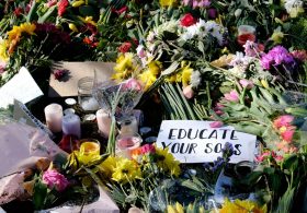 College Green, Bristol, UK. 16th Mar 2021. Floral tributes laid during the reclaim the Streets vigil for Sarah Everard. Courtesy JMF News/Alamy Live News