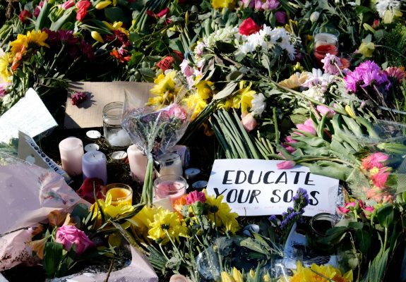 College Green, Bristol, UK. 16th Mar 2021. Floral tributes laid during the reclaim the Streets vigil for Sarah Everard. Courtesy JMF News/Alamy Live News