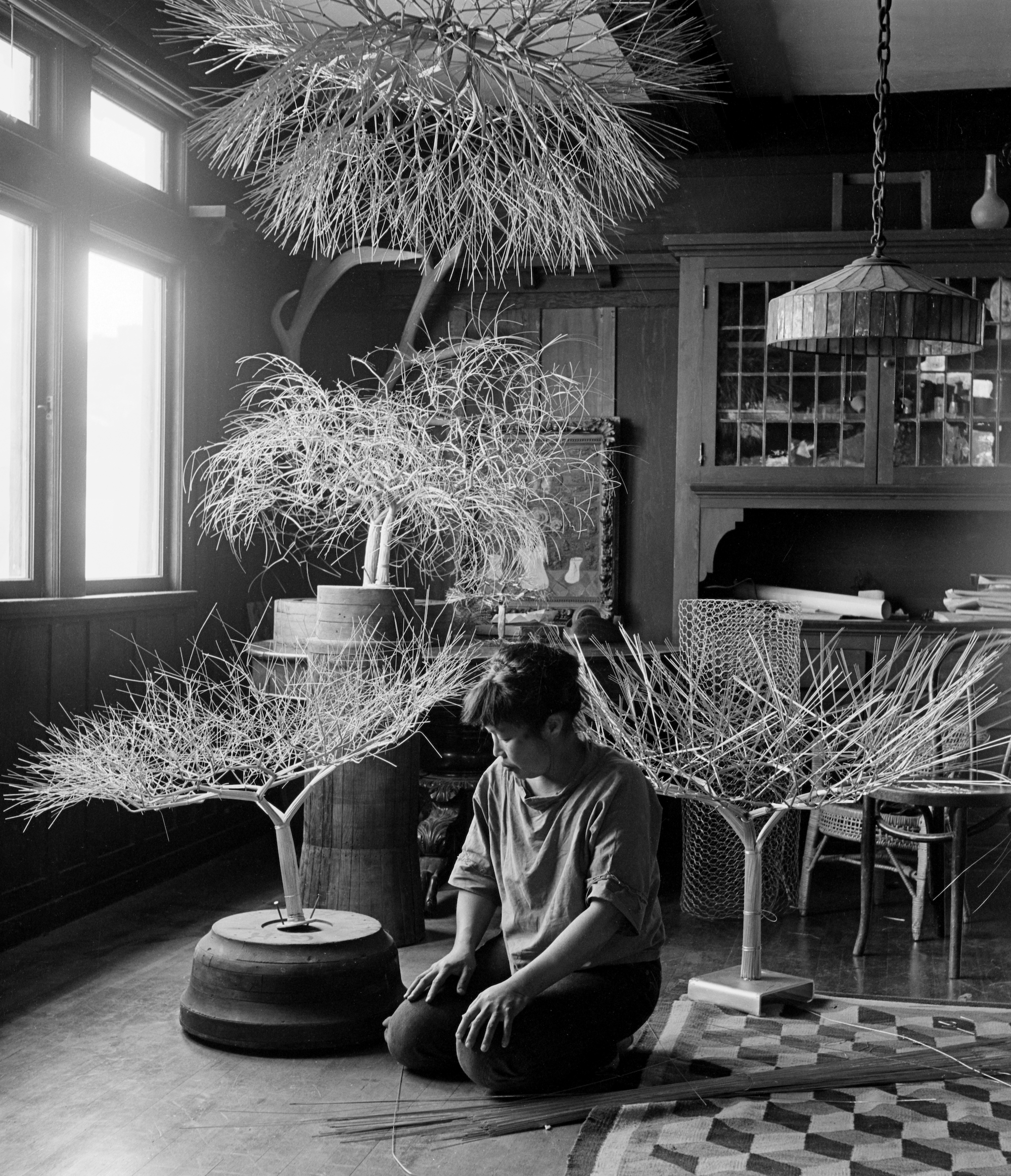 Imogen Cunningham, Ruth in Her Dinning Room with Tied-Wire Sculptures, 1963