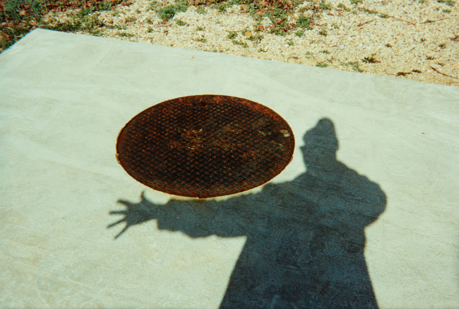 Shadow and manhole, spring 1992