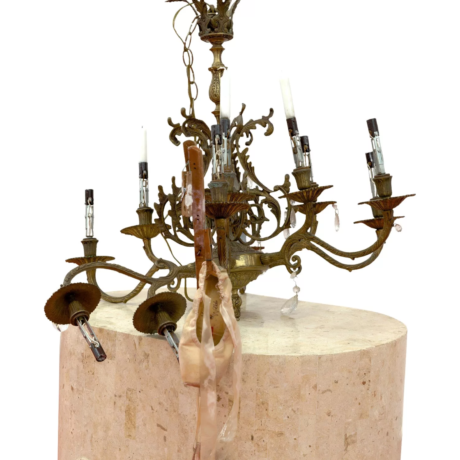 3. Lizzi Bougatsos, Idolize the Burn, 2022, Brass chandelier, red wax, silver, candles, resin dipped toe shoes, and wood. Courtesy of the artist and James Fuentes Gallery, NY.